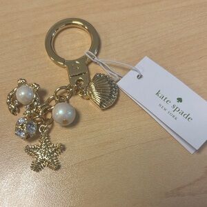 Kate Spade Gold Charm Keychain with Pearls sea charm theme